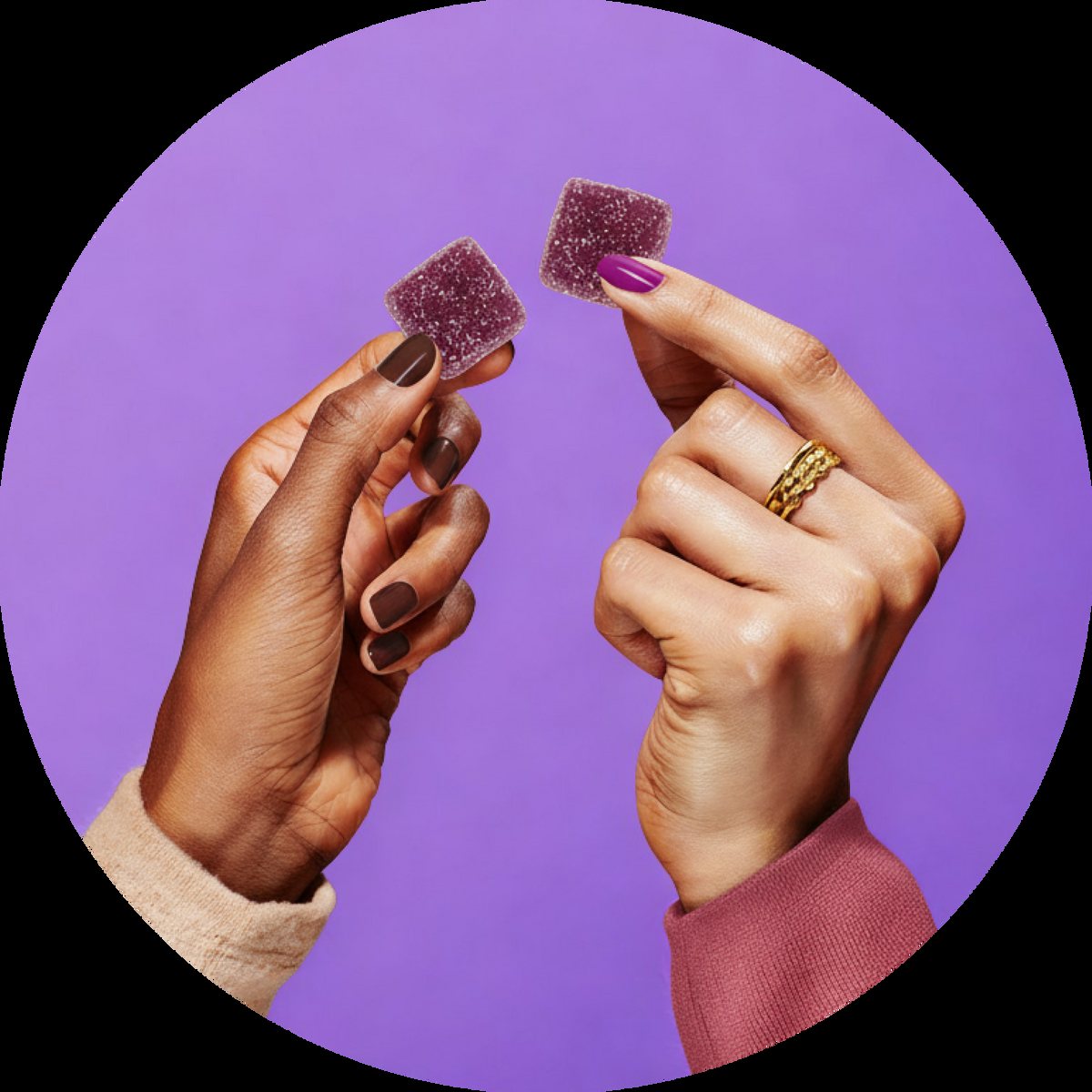 Two hands each holding a MoonBrew sleep gummy
